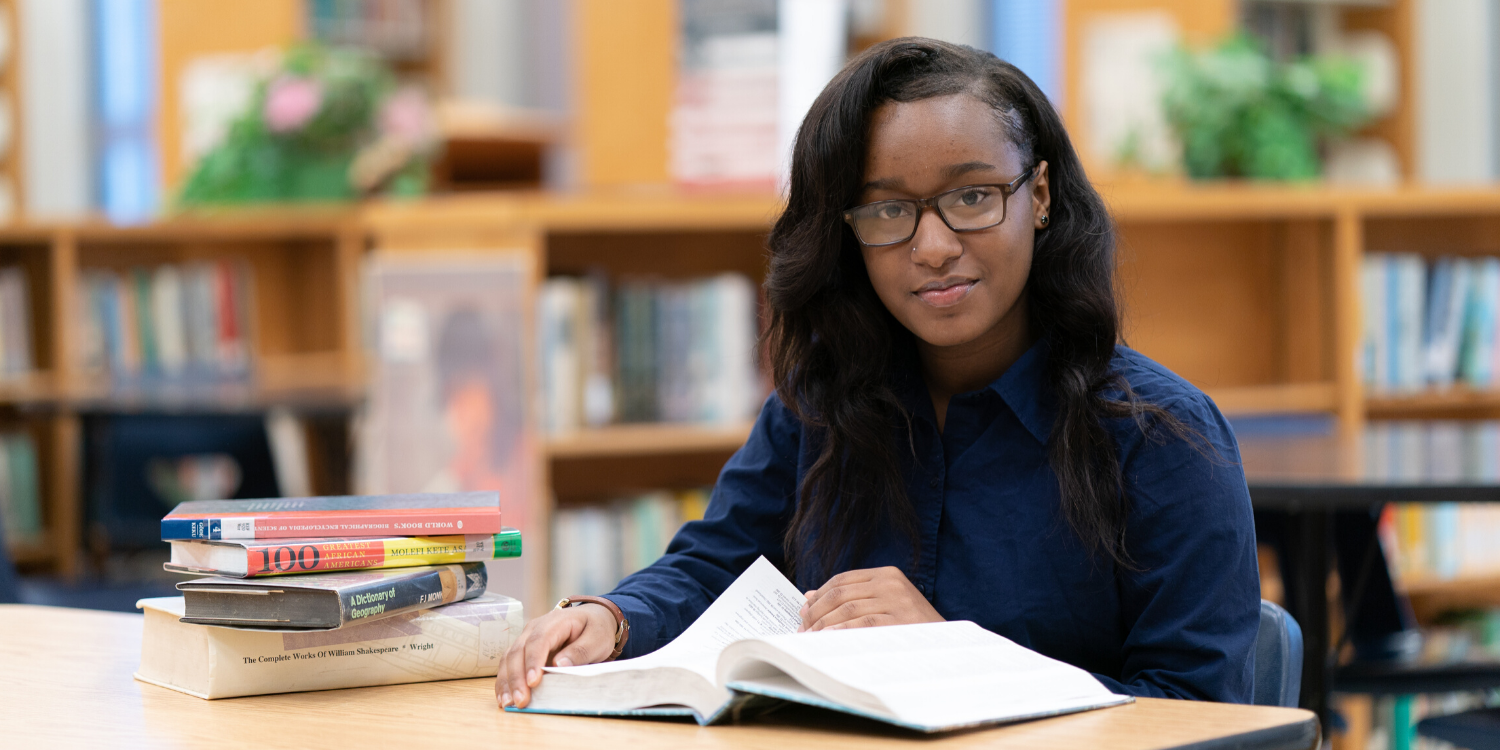 Female student reading in the library