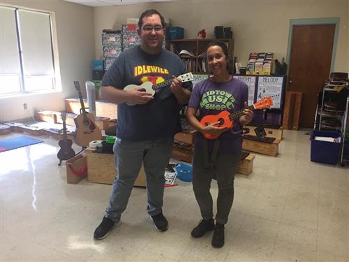 Mr. Moody with a parent in th music room 