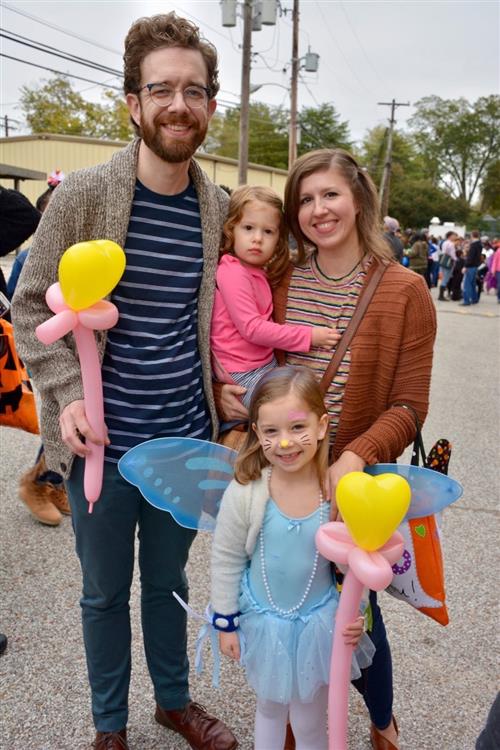 Family with student in costume at the Fall Carnival 